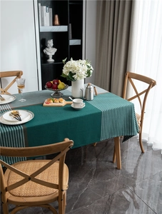 Detail of dark green and grey geometric plaid tablecloth with textured diagonal weave