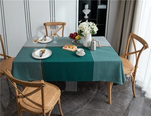 Detailed view of dark green plaid tablecloth with thick jacquard woven texture