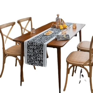 Modern black and white jacquard table runner with English letter prints and wave edges