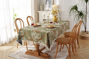 Detail of sunflower jacquard pattern on rectangular tablecloth with white fringe trim
