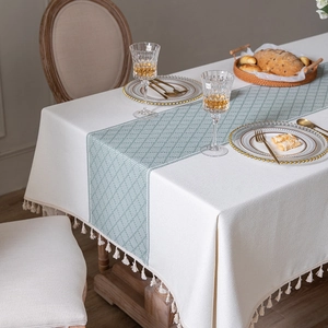 Polyester jacquard tablecloth with green geometric lattice pattern and tassel edges