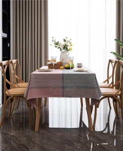 Close-up of pink and black houndstooth geometric pattern on a high-quality tablecloth