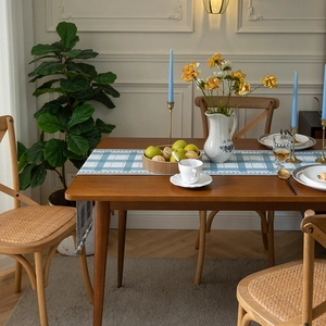 Modern minimalist blue and white checkered table runner with elegant beaded tassels
