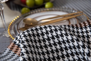 Close-up detail of thickened houndstooth jacquard fabric with elegant fringe edge texture