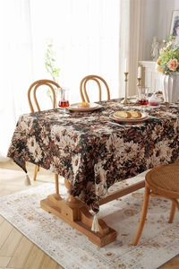 Detailed view of vintage oil painting daisy patterns on jacquard fabric with fringe tassels