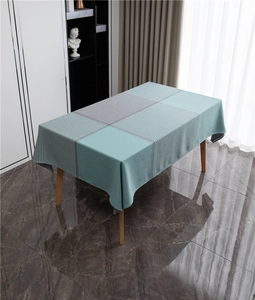 Detail of green and grey geometric houndstooth pattern on high-quality table cloth fabric