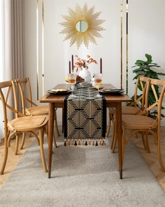 Detail of American retro table runner with geometric jacquard patterns and tassels