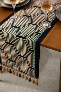 Detailed view of American vintage table runner with jacquard geometry and luxury tassels