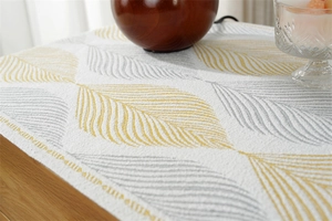Macro shot of 3D textured jacquard fabric with yellow leaf pattern for furniture protection