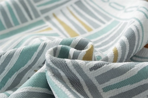 Macro shot of geometric woven fabric detail with thick texture and mint green stripes