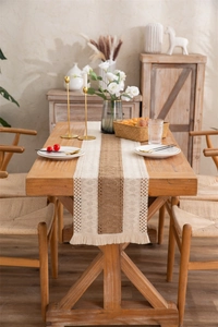 Detailed texture of cotton linen table runner with tassels and woven diamond pattern