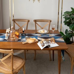 Luxurious geometric jacquard table runner with golden threads and tassels for home decor