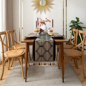 Vintage geometric table runner with navy blue jacquard pattern and brown fringe tassels