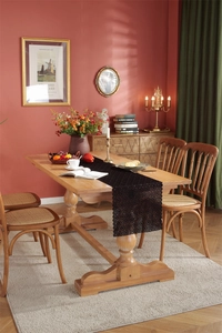 Detailed macro view of black lace table runner featuring intricate hollow flower patterns