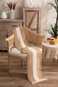 Close-up of rustic handwoven table runner showing intricate cotton linen textures and tassels