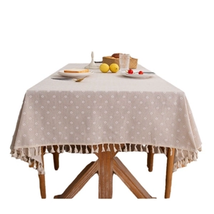 Modern rectangular tablecloth with daisy embroidery and elegant fringe tassels in beige