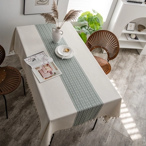Beige polyester jacquard tablecloth with green geometric table runner and fringe