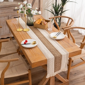 Rustic cotton linen table runner with woven stripes and handmade tassels for dining decor