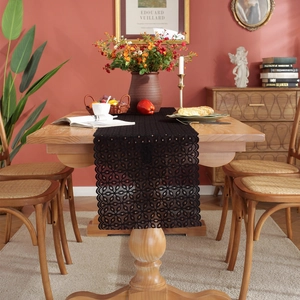 Romantic black lace table runner with hollow floral pattern for elegant wedding decor