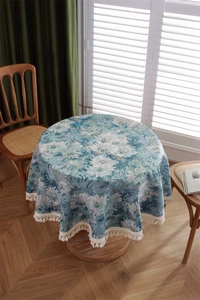 Detailed macro view of retro blue daisy jacquard fabric with white cotton fringe trim