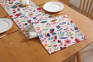 Detailed view of Easter floral table runner with colorful botanical print on thick fabric