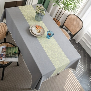 Gray jacquard rectangular tablecloth with yellow leaf pattern and white tassel edges