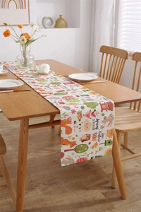 Close-up of Easter table runner with cute woodland animals and Happy Easter printing