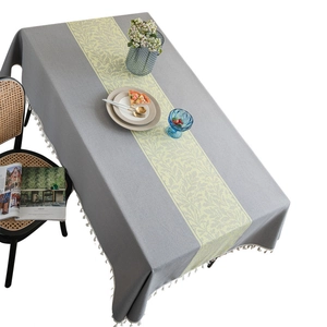 Gray rectangular tablecloth featuring yellow leaf pattern and white tassel fringe trim