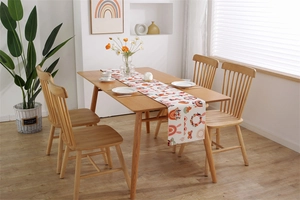 Detail of bohemian Easter table runner with rainbow and floral digital print on thick fabric
