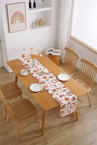 Detail of Easter table runner with bunny and rainbow prints on thick cotton polyester fabric