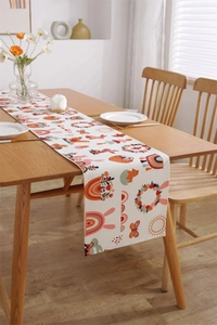 Detail of bohemian Easter table runner with bunny and floral print on thick cotton fabric