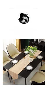 Close-up of luxury gold table runner with geometric jacquard pattern and elegant tassels