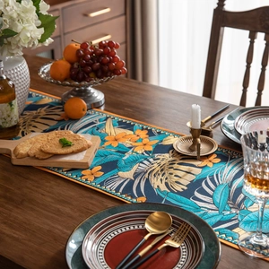 Chemin de table jacquard rétro aux motifs tropicaux de feuilles de monstera et glands