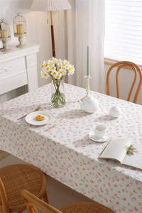 Detail of floral rectangular tablecloth with polka dot jacquard and leaf pattern embroidery