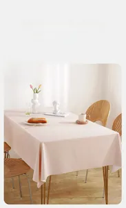 Close-up of matte soft pink PVC tablecloth with lambskin texture on a rectangular table