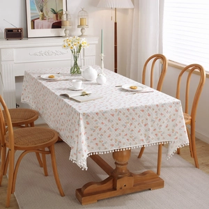 French floral cotton tablecloth with leaf patterns and elegant white pom-pom fringe
