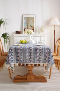 Detail of bohemian geometric tablecloth with white fringe edges and jacquard texture