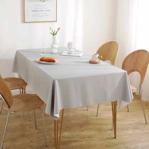 Waterproof light gray PVC tablecloth for rectangle dining table in a minimalist home setting