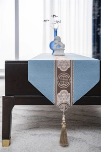 Detailed view of New Chinese style table runner with blue and brown tassels and patterns