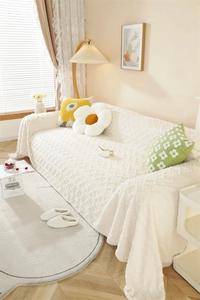 Close-up of thick plush sofa cover featuring cream jacquard diamond relief pattern