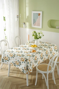 Polyester tablecloth with yellow stars and moons pattern in a cozy dining setting