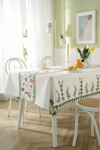 Detailed close-up showing Easter table runner with floral patterns and bunny motifs