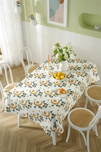 Detail of waterproof tablecloth featuring crescent moons and stars in a bright dining scene