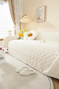 Detail of cream white thickened plush sofa cover with geometric jacquard texture