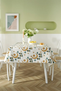 Detail of waterproof tablecloth with yellow crescent moon, stars and colored lanterns