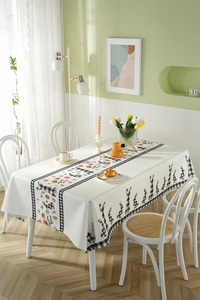 Detail of waterproof Easter tablecloth featuring plaid bunnies and daisy floral patterns