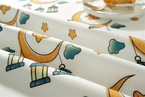 Detailed macro shot of the star and moon pattern on the textured polyester tablecloth