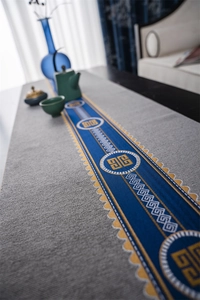 Close-up of New Chinese style table runner with blue and yellow jacquard trim and wave edges