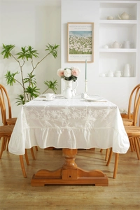 Detailed embroidery and ruffle edge on white waterproof cotton tablecloth for home decor