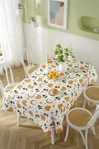 Close-up of waterproof polyester tablecloth with Ramadan moon and stars print on a white table